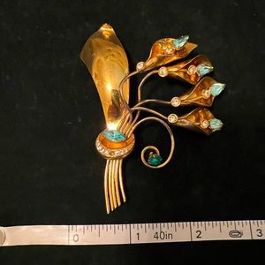 COPY - Vintage gold tone brooch with blue and white rhinestones.